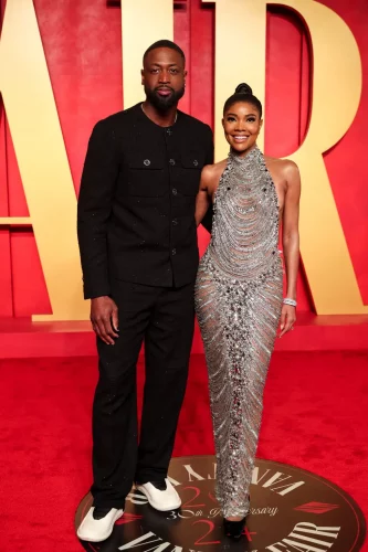 Gabrielle Union veste Zuhair Murad. À esquerda, Dwyane Wade - Foto: Christopher Polk/WWD